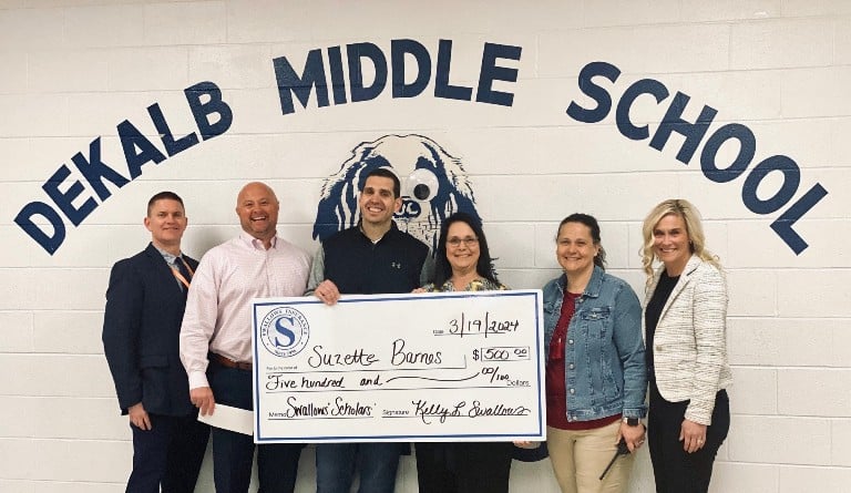 Suzette Barnes, Behavior Interventionist at DeKalb Middle School in Smithville, is the March Swallows Scholars grant recipient presented by Swallows Insurance. She will use the funds to add to the school garden to teach life and social skills while offering a therapeutic outlet for her students. Pictured for the check presentation is (l to r): Patrick Cripps, Director of Schools; Gabe Colwell, Swallows Insurance; DMS Principal Caleb Shehane; grant recipient Suzette Barnes; DMS assistant principal Teresa Jones, and Kelly Swallows, Swallows Insurance. The Swallows Scholars grant is open to any teacher in DeKalb, Overton or Putnam counties.