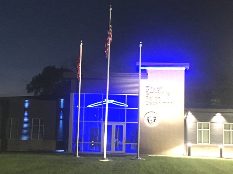 Is the County following proper protocol for displaying the Tennessee and American flags at night? During the public comment period of Monday night’s regular monthly meeting, Steven Cantrell addressed the county commission about his concern that the flags at county buildings are not being illuminated at night as they are at the Smithville Police Department building (shown here). “One night I was admiring the beautiful nighttime illumination of the US and TN flags in front of the Smithville police station—truly beautiful”. If the county can’t afford to illuminate the flags at night, then the low-cost solution is to lower them at night,” said Cantrell.