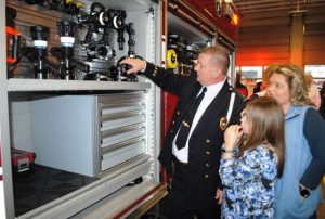 Lieutenant Donnie Cantrell of the Smithville Volunteer Fire Department showing features of the new fire truck to guests at Sunday's Open House