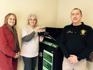 Lisa Cripps, DeKalb Drug Prevention Coalition Coordinator (center) drops off first bag of unwanted prescription medication at the new Alexandria drop box at city hall. She is joined by Alexandria Police Chief Chris Russell and Barbara Kannapel of the Smith County Drug Prevention Coalition
