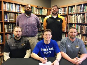 DCHS Football Senior Bradley Miller has signed to play at Thomas More College in Kentucky next season. Pictured: SEATED: Assistant Coach Tommy Hinch, Bradley Miller, Head Coach Steve Trapp; STANDING: Assistant Coaches Justin Burum and Thomas Cagle