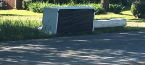 (EXAMPLE) Photo from last summer shows couch and mattress on the street in front of a residence (This particular violation no longer exists)