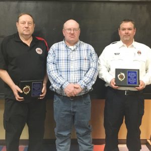 Honorary Lifetime Membership Awards were presented to Calvin Tramel (left) and Lieutenant Dusty Johnson (right). Awards presented by Jeff Williams, Honorary Lifetime Member (center)