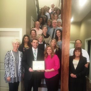 Director Suzanne Williams of the Smithville-DeKalb County Chamber of Commerce and other guests were on hand for the presentation of a Community Improvement Award to Attorney Jeremy Trapp whose law office building was recently renovated.