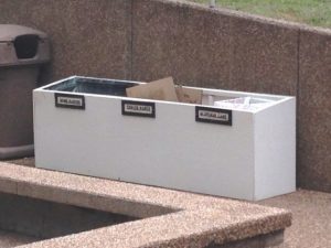 Newspaper recycling bin pulled outside after fire at courthouse on June 14, 2016