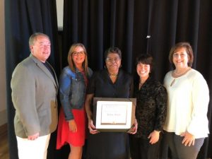 Jackie Smith receives Leadership DeKalb Alumni Legacy Award. Presented by Darrell and Beth Gill, Jen Sherwood, and Rita Bell.