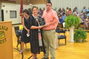 Lesa Hayes presents Hagen Waggoner with the Georgia Young award named in honor of Hayes' mother, the late DWS Kitchen Manager. (BILL CONGER PHOTO).