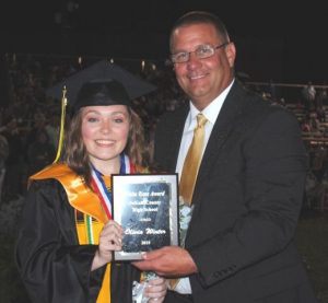 Olivia Winter Receives White Rose Award from DCHS Principal Randy Jennings