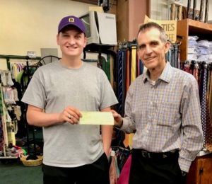 DCHS Class of 2018 President Tyree Cripps receives Project Graduation donation from Phillip Cantrell of Cantrells the home of Fluty and Fluty's Shoes