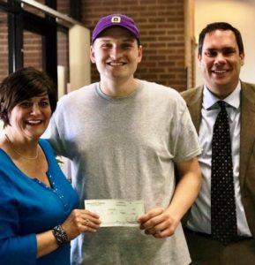 DCHS Class of 2018 President Tyree Cripps receives Project Graduation donation from Rhonda Caplinger and Casey Midgett of Liberty State Bank