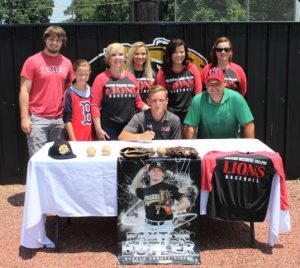 Paxton Butler signing on June 18, 2018. Shown from left to right are Jesse Smith, Caroline Butler, Ronda Butler, Leslie Watson, seated Paxton Butler, Madison Butler, Dennis Butler and Stephenee Clayton