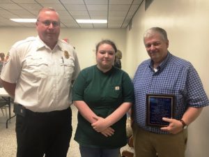 Bobby Hull (right) has received the DeKalb Fire Department’s Citizen Hero Award. The presentation was made to Hull by Courtney Nichols (center). Hull is credited for helping save the life of Nichols who was involved in a March traffic accident. Fire Chief Donny Green also pictured