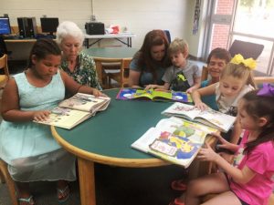 Pictured: Kaydence Johnson, Retired Teacher Carolyn Adcock, Chrystal Reed, Tristan Reed, Northside Elementary Librarian Libby McCormick, Taylor White, and Hayden Reed