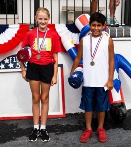 One-Mile Fun Run (age 12 and younger) winners: 11 year old Sylvia Evans of Smithville and 10 year old Gabe Taylor of Readyville. (Photo by Bill Luton Luton's Web ~ Photography ~ Design)