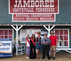 Jamboree Queens Keara McKinsey Milligan and Addison Jean Puckett join Shan Burklow and Jamboree President and Coordinator Sam Stout in presenting the 2018 Blue Blaze Award to Michael Cleveland