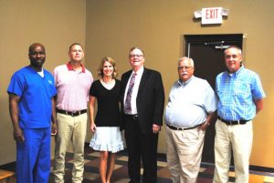 Newly elected school board members with Judge Bratten Cook, II: Shaun Tubbs, Jim Beshearse, Kate Miller, Judge Cook, Danny Parkerson, and Alan Hayes.