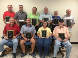 Retiring County Commissioners received plaques for years of service during their last commission meeting.