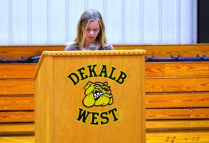 Aniston Farler leds the assembly in a prayer for our schools. (Bill Conger Photo)