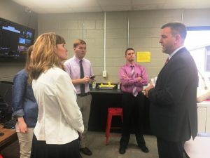 Chris Townson, CEO of DTC Communications (RIGHT) tours Makerspace at DCHS Thursday. Speaking with Dr. Kathy Bryant, Amy Fricks, Cody Burton, and Director of Schools Patrick Cripps