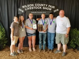 Central Region Outdoor Meat Cookery Champions: Leigh Fuson (4-H Agent), Lily Martin, Hailey Bogle, Clayton Crook, Creston Bain, and Johnny Barnes (Agriculture Agent)