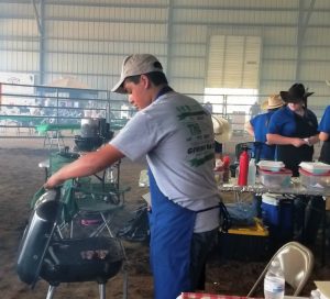 Creston Bain checks on his 1st place lamb chops