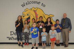 DeKalb West Students of the Month: Logan Winfree, Jacob Blair and Presley Harrington. Back row left to right: Madison Martin, Emeri Barrett, Bryna Pelham, Karly Vickers, Caitlin Shoemake, Devin Neal, and Assistant Principal Joey Agee. Not pictured: Curtis Fox