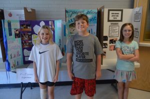 Science Fair Winners 3rd-5th grade Experiments pictured left to right are Autumn McElhaney, Ben Barton, and Charlotte Cripps.