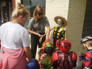 US Army Corps of Engineers Park Ranger Sarah Peace passing out candy to kids during Trick or Treat Halloween Downtown last year