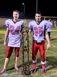 Saints Standouts Colby Barnes (left) and Josh May with Conference Championship Trophy