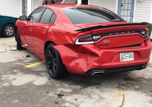 Patrick Lee's Buick Enclave struck this 2016 Dodge Charger parked at Town Edge Village Apartments