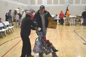 Mack Harney helps family with meals for Thanksgiving (Bill Conger Photo)