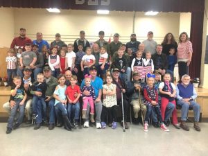 Smithville Elementary students with members of their families (veterans) following an annual tribute program for local hometown heroes last year