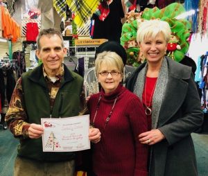 Window Display: “Crowd Favorite”- Cantrell’s Clothing’s The Grinch. Owners Phillip and Marilyn Cantrell with Chamber Director Suzanne Williams