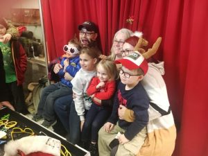 Christmas on the Square 2018: grownups and kids enjoy having photos made of themselves with special props and poses by Cosmo Creations photo booth