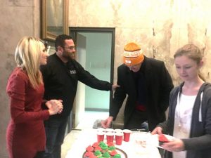 Smithville Mayor Josh Miller greets Mike Braswell during Christmas on the Square in 2018. Mayor Miller and wife Melissa and city employees served refreshments at city hall