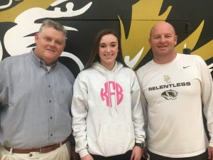 Lady Tiger Coach Danny Fish and Lady Tiger player Kadee Ferrell with the Voice of the Tigers and Lady Tigers John Pryor. Kadee led the team in scoring with 26 points in a 78-68 win over undefeated White County Friday night in Smithville