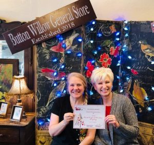 Window Display: “Most Original”: Button Willow General Store’s Home for the Holidays. Owner Angela Brown with Chamber Director Suzanne Williams