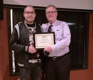 Recovery Court Graduate Carlos Santos with Judge Bratten Cook, II