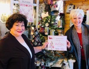 Window Display: “Chamber Choice” The Vintage Owl’s Charlie Brown Christmas. Vintage Owl Employee Louise Prater with Chamber Director Suzanne Williams