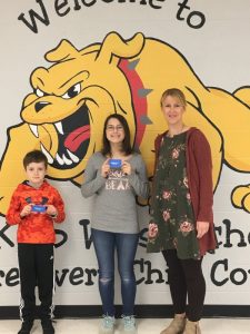 DeKalb West School Principal Sabrina Farler presents Maddux Pyburn and Gabby Wheatley perfect attendance awards