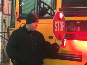 All DeKalb County School buses are undergoing an annual state inspection this week by State Troopers Darryl Winningham and Craig Wilkerson of the Tennessee Highway Patrol. Wilkerson shown here examining bus stop sign.