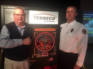 Blake Cantrell, Communications Officer and firefighter with the Cookeville Highway Station, was selected to receive the Tenneco 2018 “Git R Done” Award presented by Lieutenant Andy Pack (right).