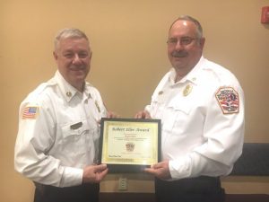 Smithville Volunteer Firefighter and Deputy Chief Hoyte Hale (right) received the “Robert Eller Highest Attendance Award from Chief Charlie Parker