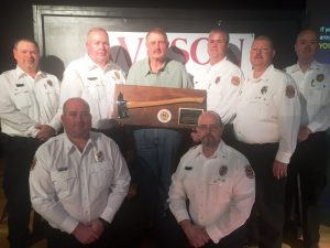 Hugh Washer, firefighter with the Cookeville Highway Station received a special honorary fire axe plaque recognizing his 41 years of exceptional and dedicated service presented by the DeKalb Fire Department’s officers: SEATED Captains Brian Williams and Michael Lawrence. STANDING: Lieutenant Dusty Johnson, Chief Donny Green, Hugh Washer, Lieutenant Andy Pack, Captain Jay Cantrell, and Assistant Chief Anthony Boyd