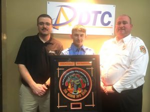 The DeKalb Telephone Cooperative (DTC) Rookie of the Year Award went to Firefighter Travis Checci of the Liberty Station presented by Captain/Training Officer Brian Williams (right). Also pictured Nick Nokes of DTC Communications (left)