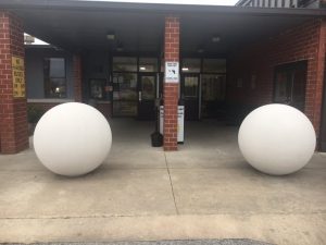 Picture shows Safety sphere bollards at the entrance of Smithville Elementary as a security measure.. Bollards have also been placed at Northside Elementary and DeKalb Middle School
