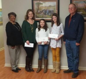 The Fifth Grade Essay Winners and their teacher were presented awards at the DeKalb Farm Bureau Board Meeting on March 5th. The subject for the essays was “Why is Agriculture Important?” Pictured are Cathy Officer, Farm Bureau Women’s Chair who presented $50.00 to Kristy Lasser, teacher with the most entries, $50.00 to Cali Agee, First Place Essay, and $25.00 to McKenna Miller, Second Place Essay, and Mack Harney, DeKalb Farm Bureau President. Cali’s Essay goes on to State for judging on April 27th.