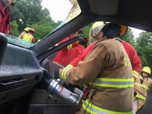 2018 Citizens Fire Academy participant Amy Cripps using the Jaws of Life