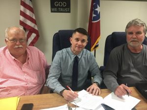 Director of Schools Patrick Cripps signs two year contract extension as approved by the Board of Education Cripps is pictured with the Chairman of the Board W.J. (Dub) Evins, III (right) and Vice Chairman Danny Parkerson