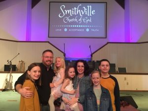 Pastor Chris Moore of the Smithville Church of God, the focus of WJLE's Preacher Feature this week, with his wife Holly and their children: Left to right-Sadie, Chris holding Skyla, Holly holding Saige, Sara, and Samuel.